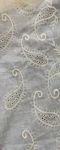 White-on-white paisley eyelet embroidery on fine cotton.