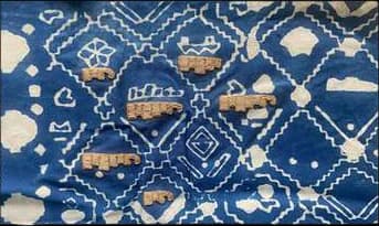 Indigo lattice print with gold dabka motifs applied.