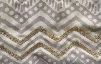 Grey chevrons couched with gold dabka thread.