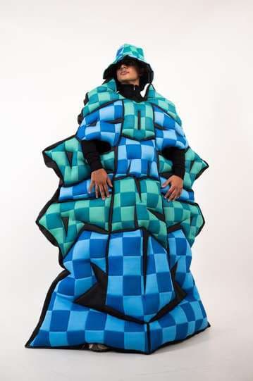 Final garment: a teal and cobalt checkerboard puffed cape, front.