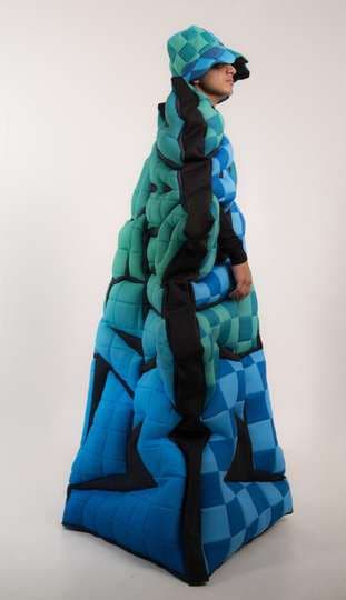 The checkerboard cape in profile, rising into a tower.