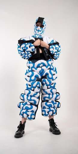 The squiggle suit, arms folded.