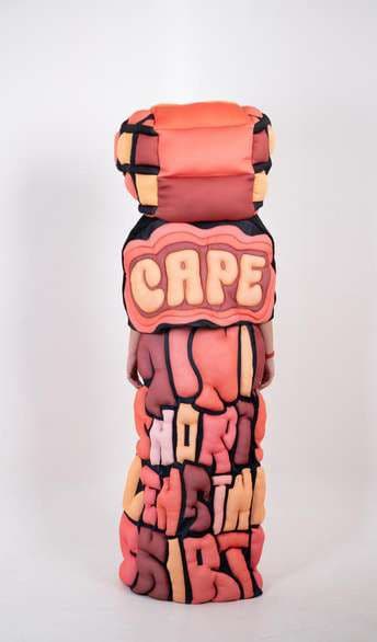 The coral cape from the side, lettered CAPE.