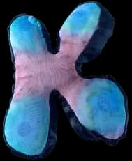 A puffed, tie-dyed fabric letter K.